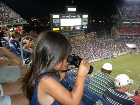 Kasen using binoculars to check out the game